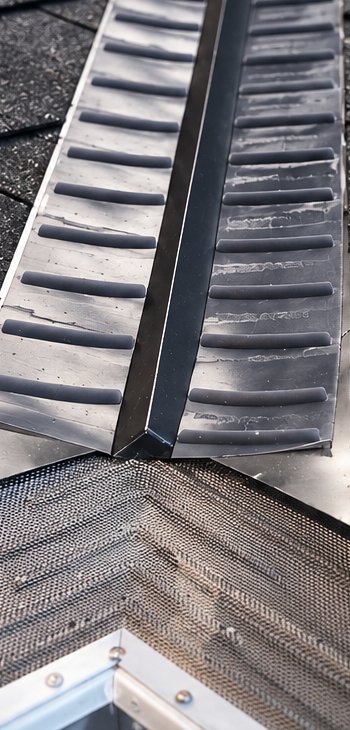 The Valley Guard installed in a roof valley above a gutter corner
